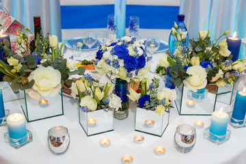 Wedding table arrangement with flower and candle