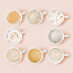 Fototapeta na wymiar Set of Coffee cups assortment on pale pink background. Flat lay, top view collection