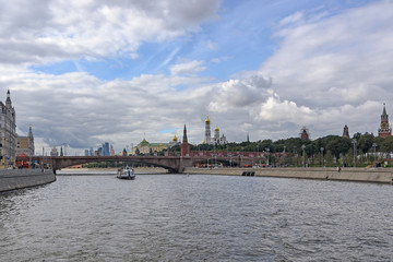 Moscow River. Pleasure boat. View of the Kremlin, Moscow City, Bolshoy Moskvoretsky Bridge.