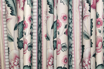 Linen drapes or curtains with a floral pattern