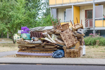 Big pile of old furniture and household goods on the roadside