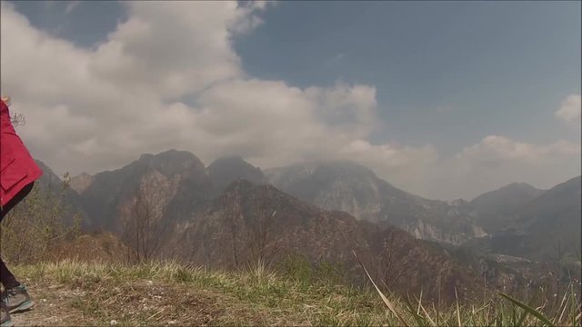 Time lapse (static) of clouds moving upon a mountain wilderness environment