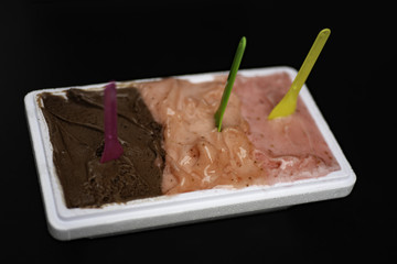 Ice-cream Gelato and Sorbet combo open container: three type - chocolate, strawberry and raspberry.