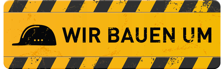 gelbes Schild Wir bauenn um mit Helm-Icon