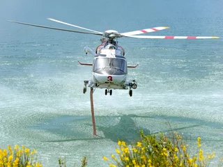 Foto op Plexiglas Agusta AW-139 Fire Department helicopter  takes on Water © Robert