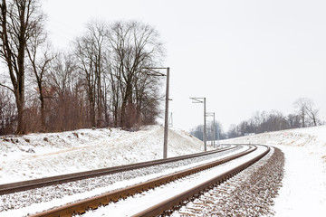 Fototapeta premium Snow Covered Railway Track. The view along a snow covered railway track in Sigulda, Latvia.