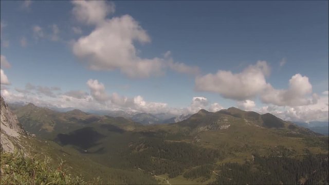 Time lapse (static) of clouds moving upon a mountain wilderness environment