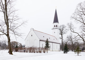 Sigulda Evangelic Lutheran Church.  Sigulda is a town in Latvia and the church is pictured on a winter day.