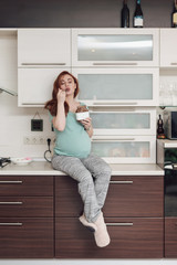  Pregnant woman enjoying eating chocolate