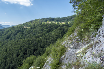 Fototapeta na wymiar Beautiful mountain view from Uhlovitsa cave. The Uhlovitsa cave, is located 3 km northeast of the village of Mogilitsa. It is among the 100 National Tourist Sites.