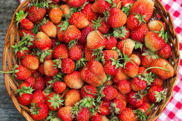 a lot of strawberries in the basket close-up