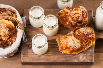 Bread buns and jars with milk 