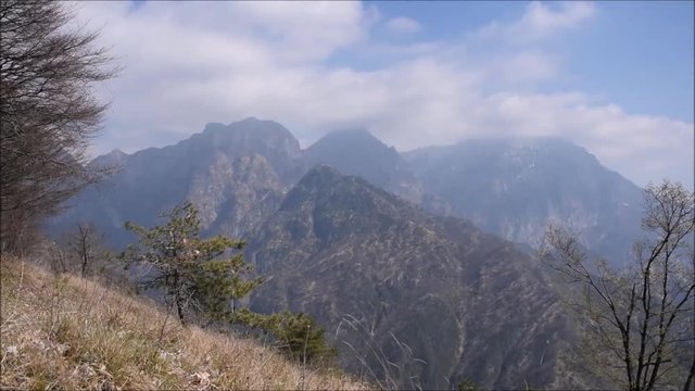 Time lapse (static) of clouds moving upon a mountain wilderness environment