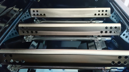 Closeup of Gas Barbecue Grill flavorizer bars covering the grill burners.