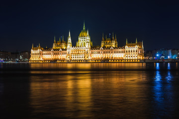 Fototapeta premium Night view of Budapest. Panorama cityscape of famous tourist destination with Danube, parliament and bridges. Travel illuminated landscape in Hungary, Europe.