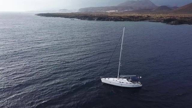 View from the height of the yacht near the lighthouse off the coast of Tenerife, Canary Islands, Spain