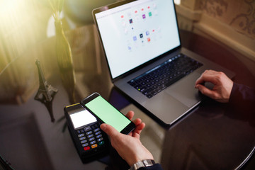 Online payment by using notebook with sun light effect.