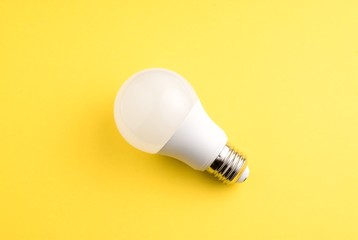 White lightbulb on a yellow backgroun