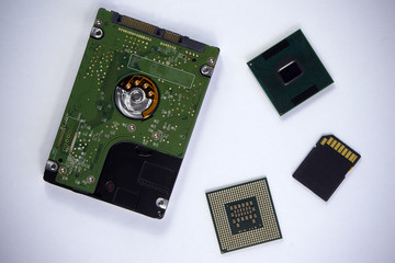 2,5 inch laptop sata hard drive with two CPU laptop processors and SD card isolated on white background