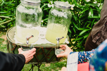 Lemon juice and natural strawberry dispenser prepared for a wedding