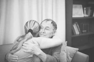 Sick mature man getting a hug