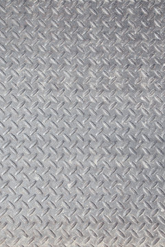Worn Polished grungy Industrial Checker Plate Background Texture with Rusty Worn Embossed Raised Diamond Pattern Wallpaper