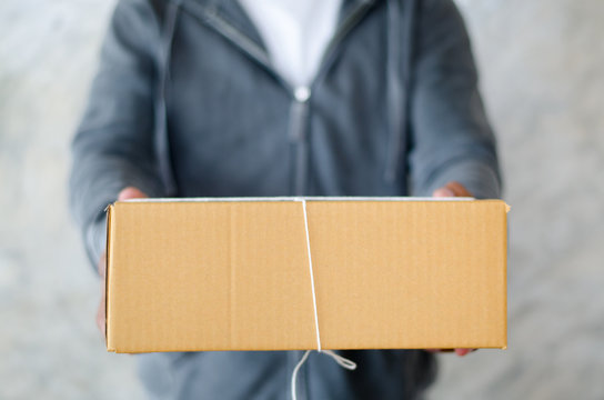 Delivery Man Carrying A Parcel Box