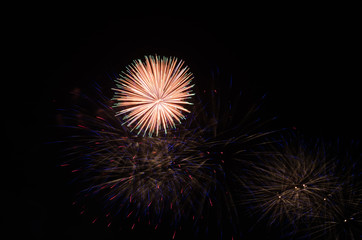 colorful fireworks on the black sky background over-water