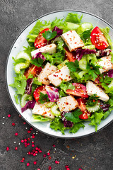 Meat salad with fresh vegetables. Vegetable salad with baked chicken breast. Vegetable salad with chicken fillet on plate