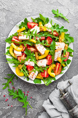 Chicken salad. Meat salad with fresh tomato, sweet pepper, arugula and grilled chicken breast. Chicken fillet with fresh vegetable salad