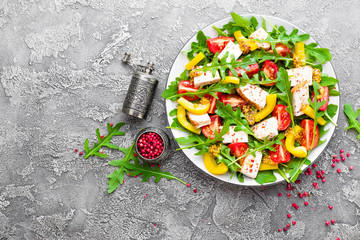 Chicken salad. Meat salad with fresh tomato, sweet pepper, arugula and grilled chicken breast. Chicken fillet with fresh vegetable salad