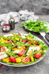 Chicken salad. Meat salad with fresh tomato, sweet pepper, arugula and grilled chicken breast. Chicken fillet with fresh vegetable salad