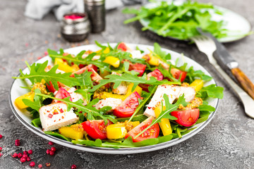 Chicken salad. Meat salad with fresh tomato, sweet pepper, arugula and grilled chicken breast. Chicken fillet with fresh vegetable salad