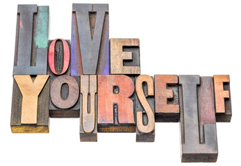 love yourself - word abstract in wood type