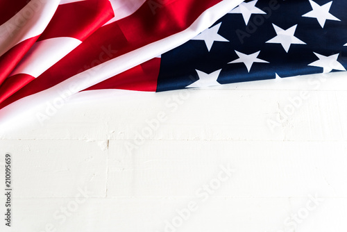 Close up United States of America flag on white wooden background. USA Independence day, 4 July.