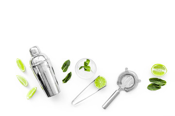 Process of making mojito concept. Ingredients and crockery. Slices of lime, mint, glass with ice...