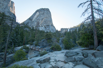 Liberty Cap rock formation and Nevada Falls in the background seen from the Mist Hiking Trail and...