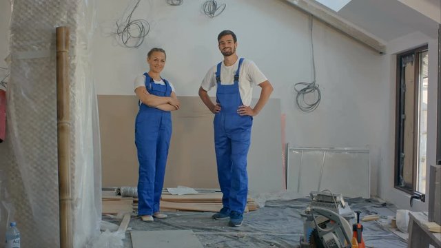 Cheerful workers team at a indoors smiling on camera