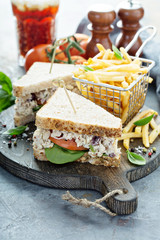 Chicken salad sandwich with spinach and tomato