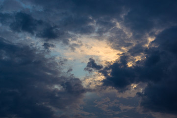 Landscape with dramatic light - beautiful golden sunset with saturated sky and clouds.