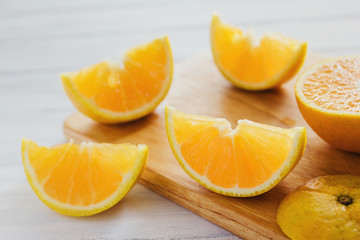 Fototapeta na wymiar oranges, orange juice and slices of fruit