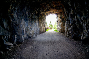 Light at the end of the Tunnel at Myra Canyon in Kelowna, BC, Canada - obrazy, fototapety, plakaty