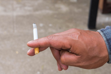 Hand with cigarette.smoking concept.