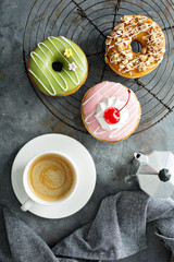 Sweet donuts with coffee overhead view