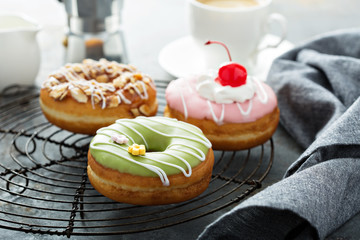 Sweet donuts on a cooling rack