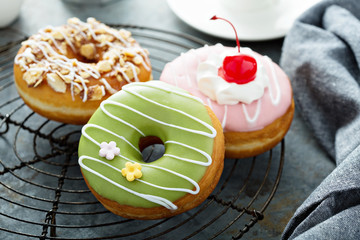 Sweet donuts on a cooling rack