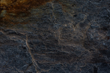 Fototapeta na wymiar Dark stones texture pattern nature background.