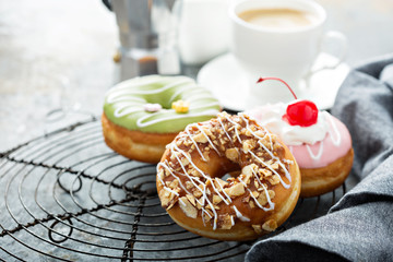 Sweet donuts on a cooling rack