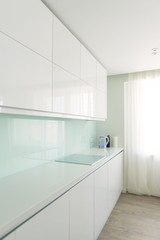 Fototapeta na wymiar White kitchen in minimalist style. Interior, design theme.