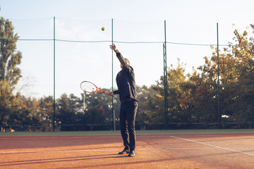 Fototapeta na wymiar Businessman playing tennis